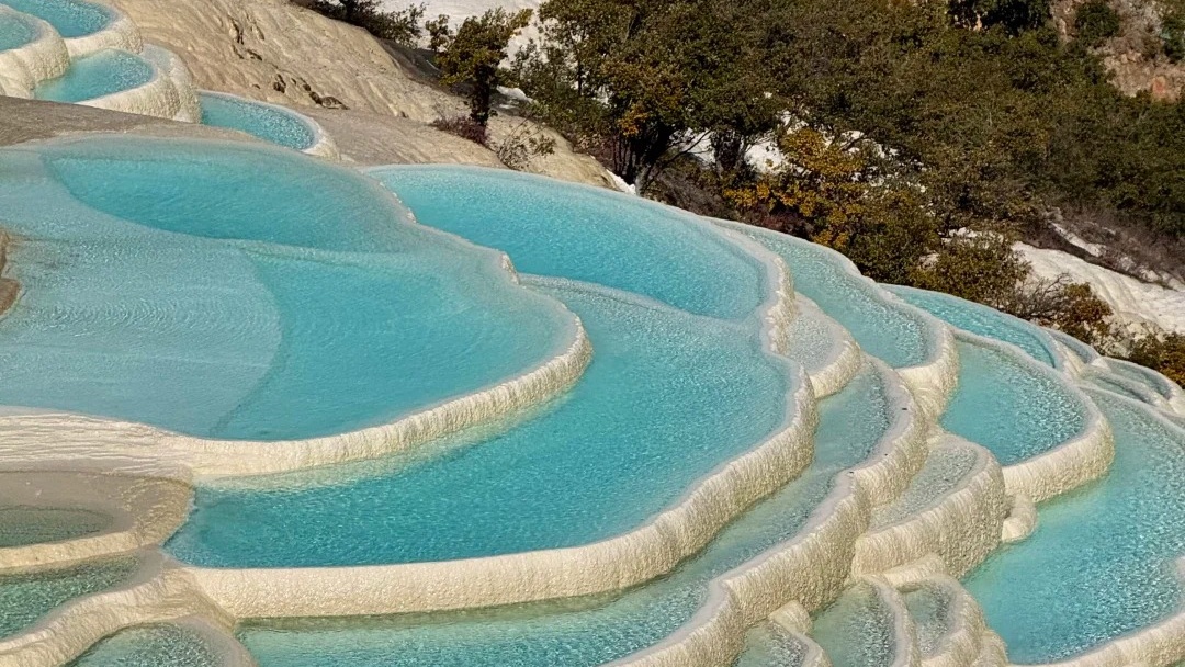 Turquoise travertine mineral pools of Baishuitai in Shangri-La Yunnan